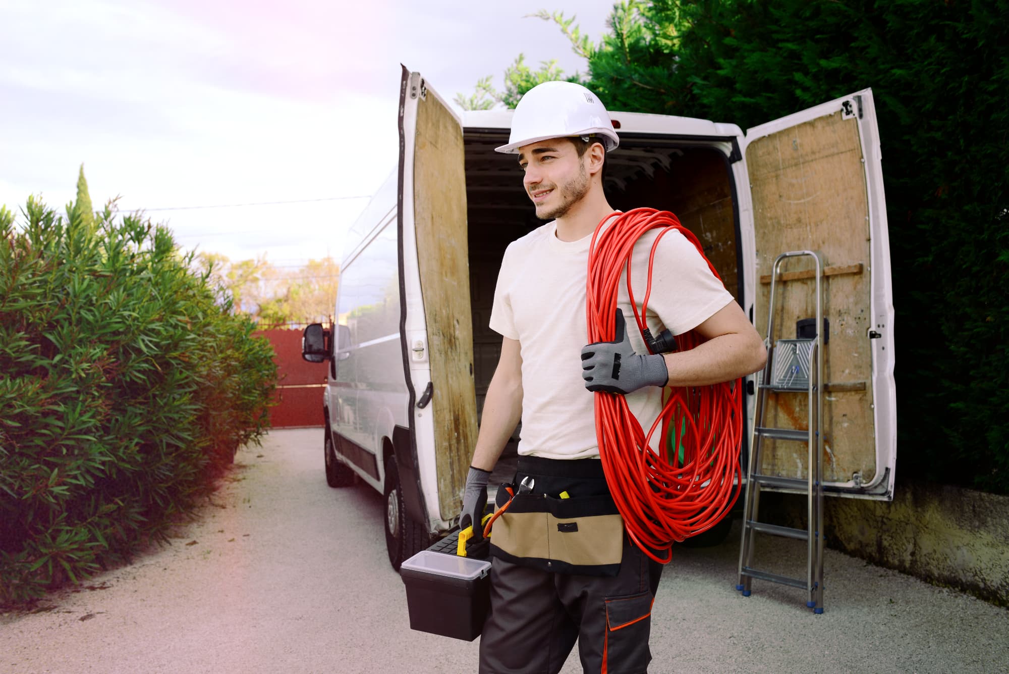 Field-service engineer arriving at a building with a tool case.